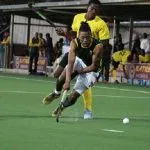 Alfred Ntiamoah tackles his opponent from behind during their match against South Africa
